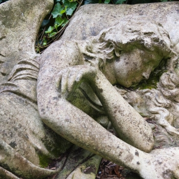A recumbent angel is a striking and most unusual sculpture